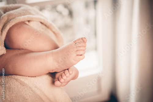 Newborn baby feet and space for text, good as background