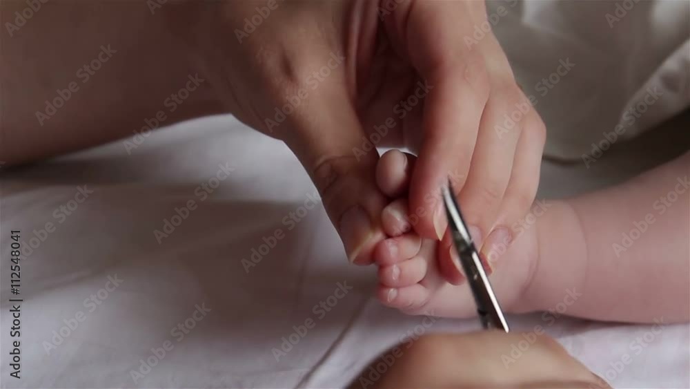 Mom has cut the baby toenail Mom has cut the baby toenail