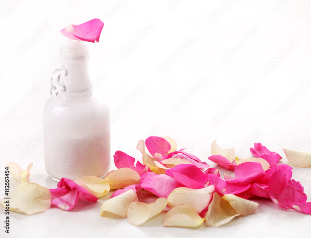 bottle and rose petals bottle and rose petals