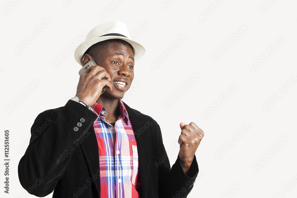 Young african american man using a mobile phone Young african american man using a mobile phone