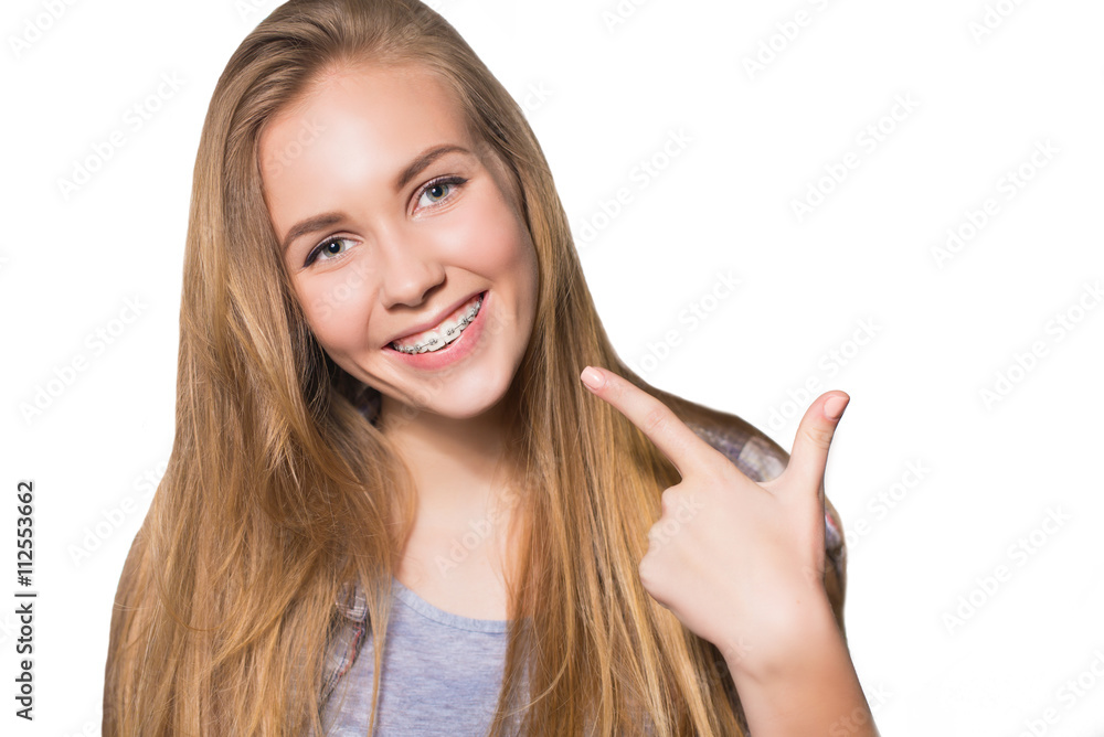 Portrait of teen girl showing dental braces. Portrait of teen girl showing dental braces.