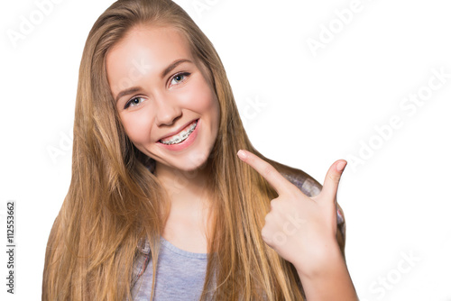 Portrait of teen girl showing dental braces.