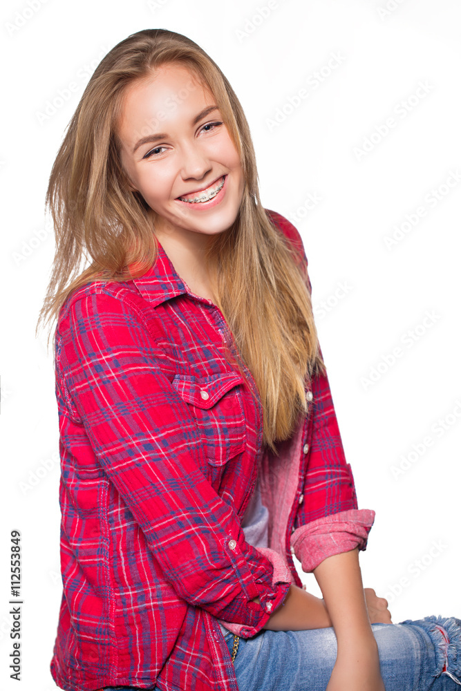 Portrait of teen girl showing dental braces. Portrait of teen girl showing dental braces.