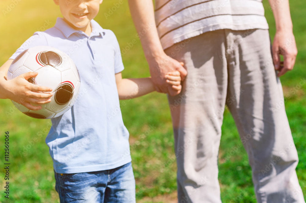 Cute friendly family came to play football Cute friendly family came to play football