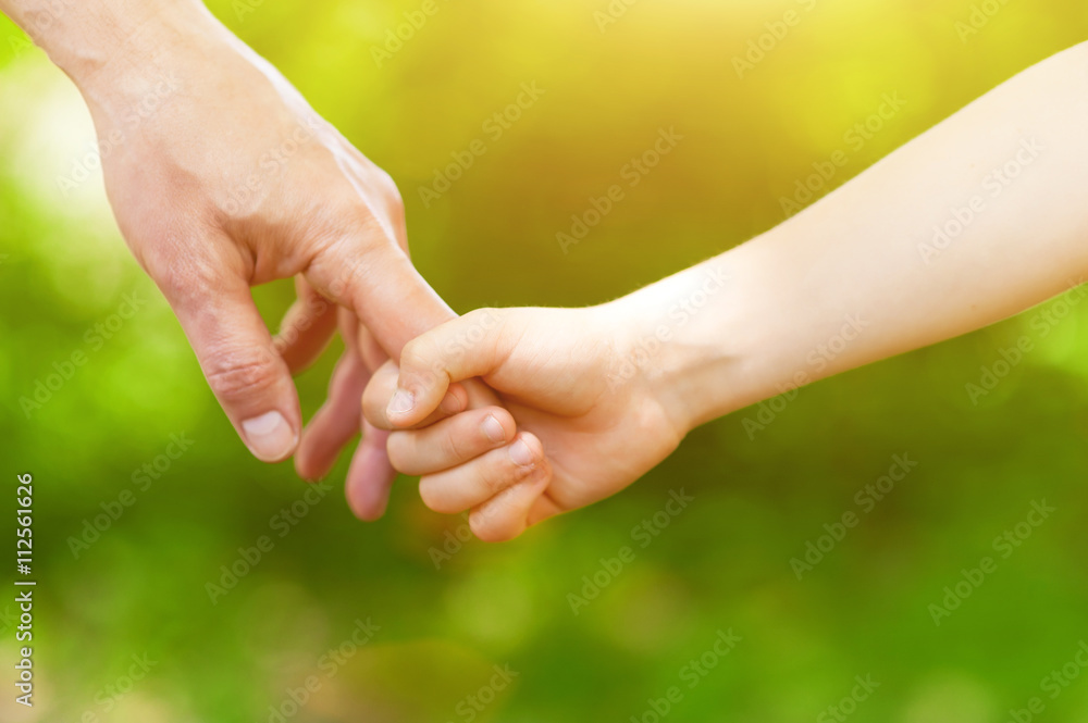 Cheerful child and grandparent enjoying walk together Cheerful child and grandparent enjoying walk together