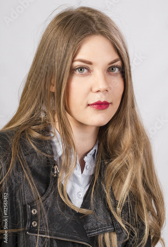 stylish girl with long beautiful hair in studio