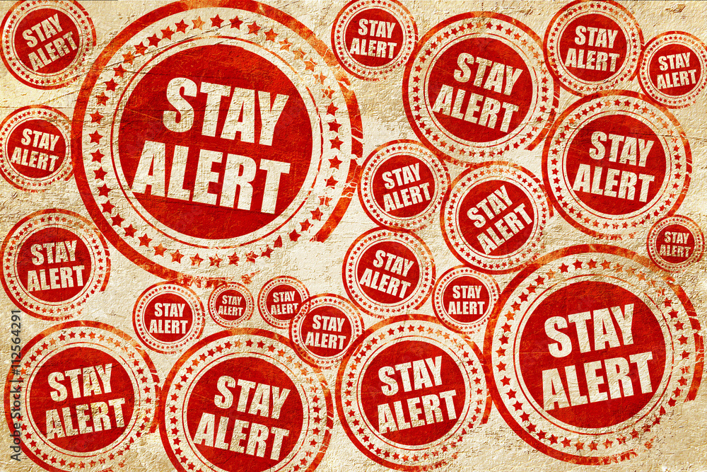 stay alert, red stamp on a grunge paper texture stay alert, red stamp on a grunge paper texture