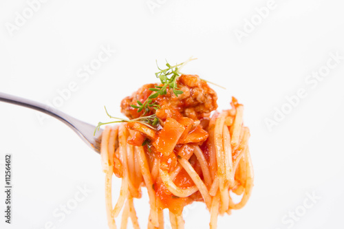 Spaghetti bolognese with garlic on a fork