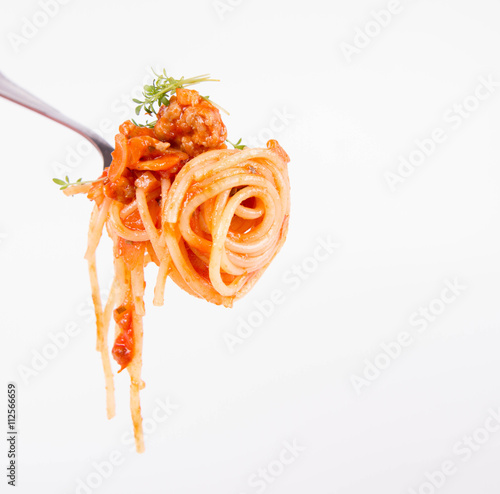 Spaghetti bolognese with garlic on a fork