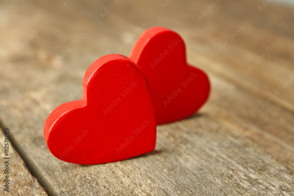 Fototapeta premium Wooden hearts on rustic wooden background