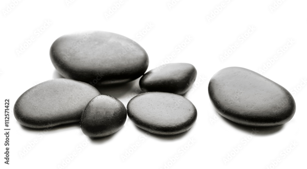 Heap of spa hot stones isolated on white Heap of spa hot stones isolated on white