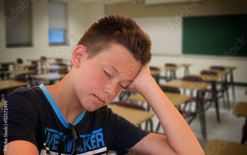 School Boy Sleeping on Desk