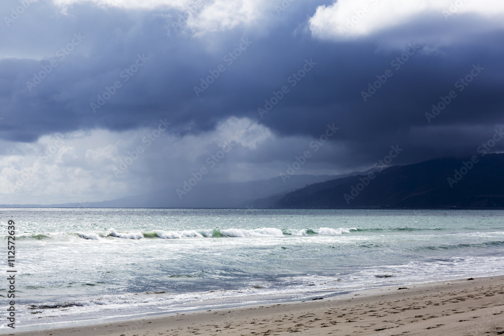 Pacific ocean during a storm. Beach landscape in the U.S. in bad weather. The ocean and waves during strong winds in United States, Santa Monica.