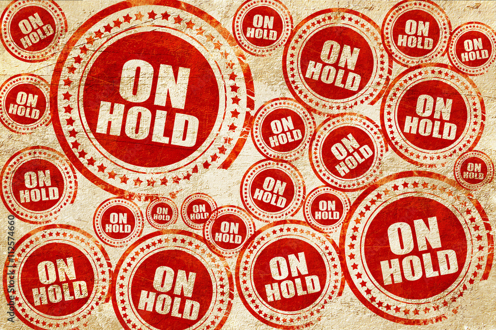 Obraz premium on hold, red stamp on a grunge paper texture