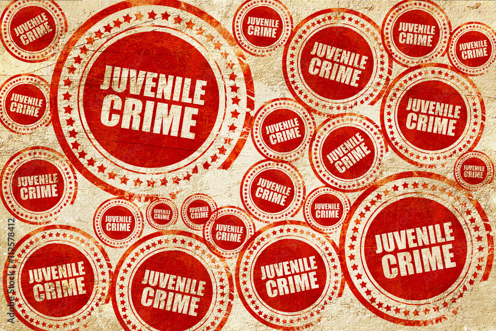Fototapeta premium juvenile crime, red stamp on a grunge paper texture