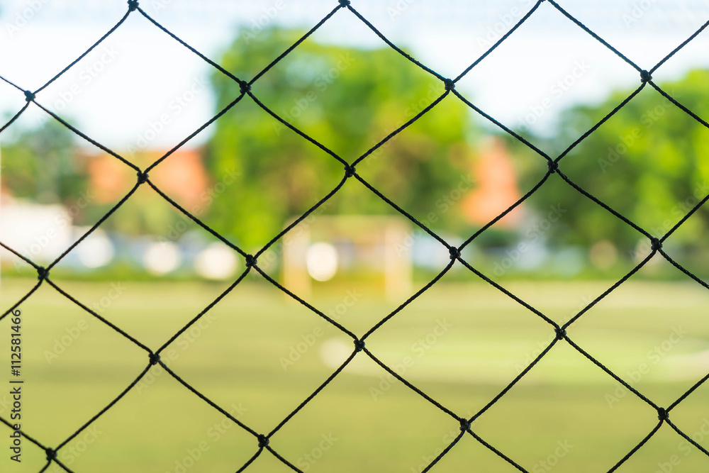 close-up net with soccer field background close-up net with soccer field background