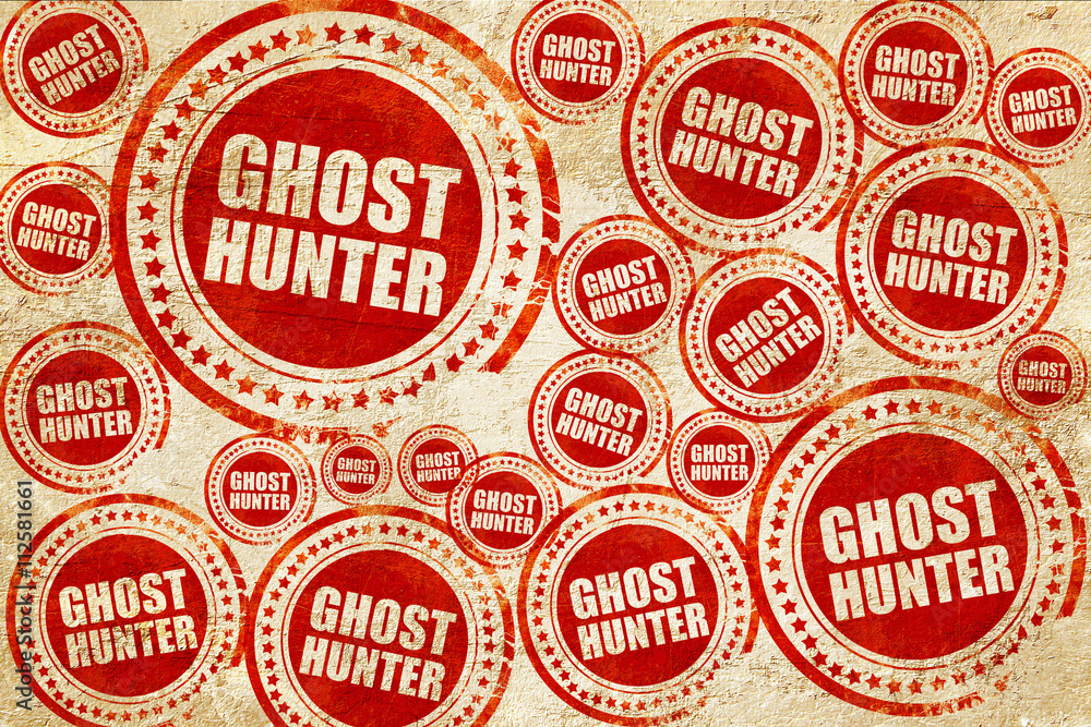 ghost hunter, red stamp on a grunge paper texture ghost hunter, red stamp on a grunge paper texture