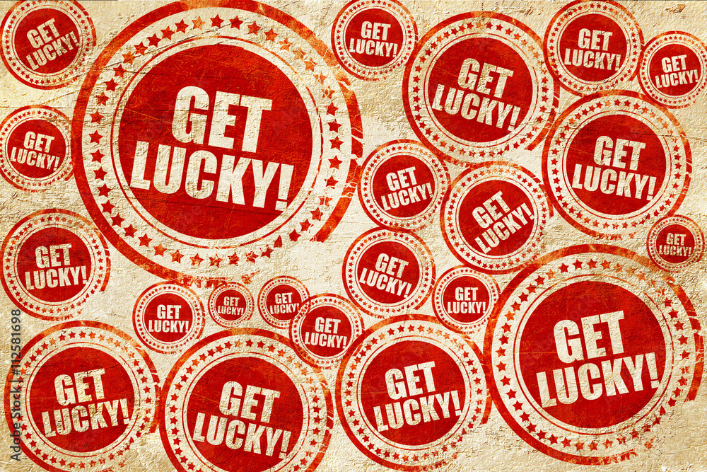 Obraz premium get lucky!, red stamp on a grunge paper texture