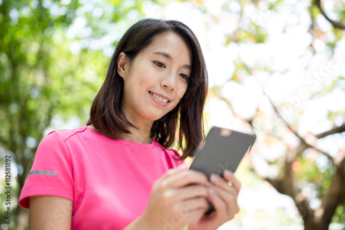 Woman use of cellphone at park