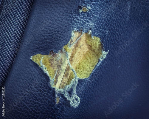 Torn leather seat