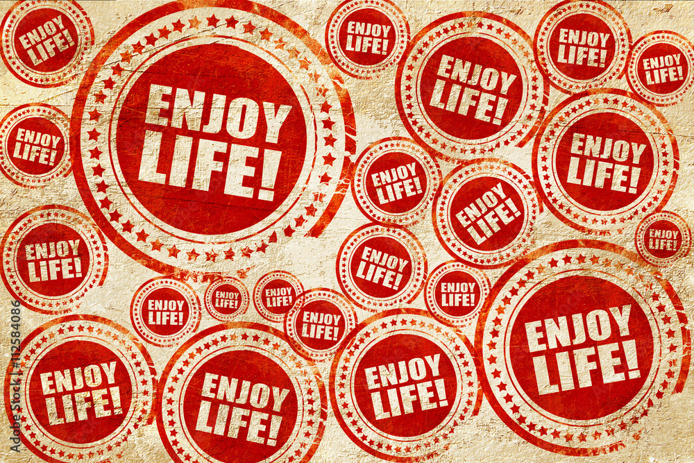 enjoy life!, red stamp on a grunge paper texture