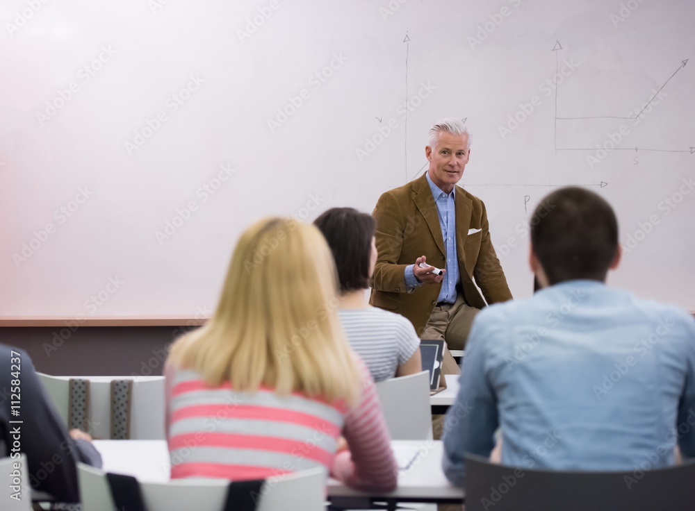teacher with a group of students in classroom teacher with a group of students in classroom