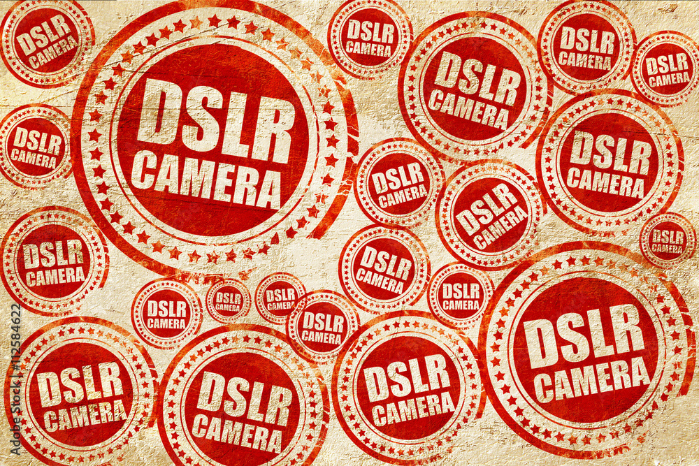 DSLR camera, red stamp on a grunge paper texture