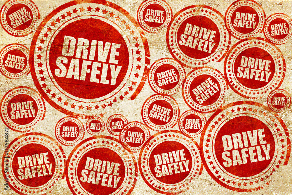 drive safely, red stamp on a grunge paper texture drive safely, red stamp on a grunge paper texture