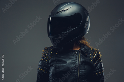 Obraz na plátně Female in motorcycle helmet and leather clothes.