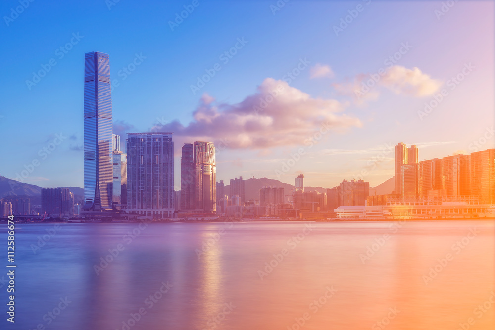 Hong kong city with river and sunrise.