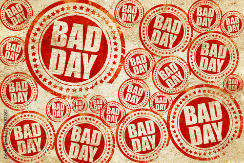 bad day, red stamp on a grunge paper texture