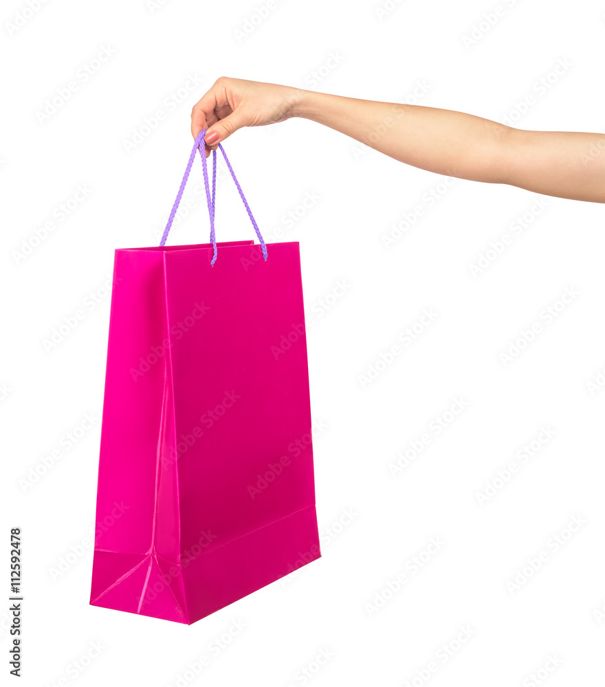 female hand holding a crimson gift bag isolated on white backgro