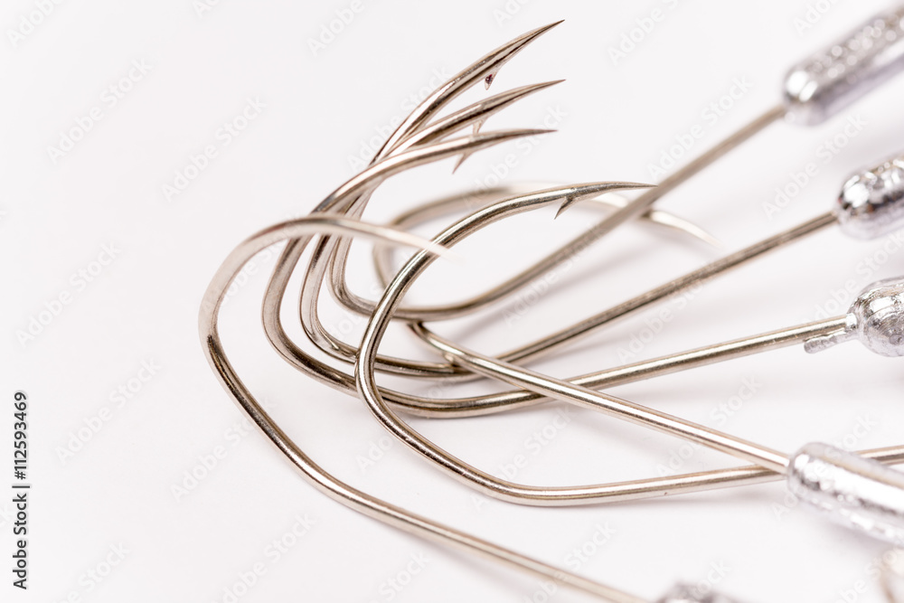 Pile of fishing hooks over white background Pile of fishing hooks over white background