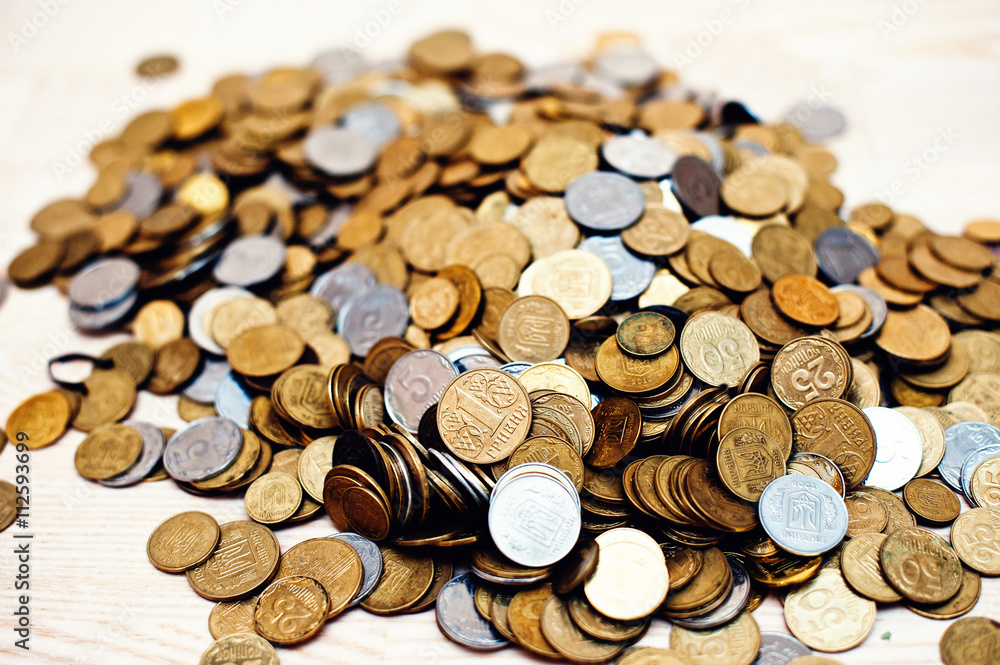 Mountain coins on wooden background Mountain coins on wooden background