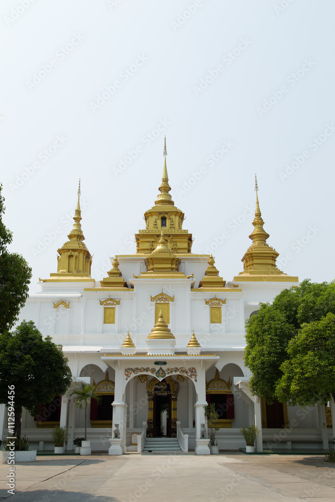 Golden and white pagoda with the blue sky, Thailand
