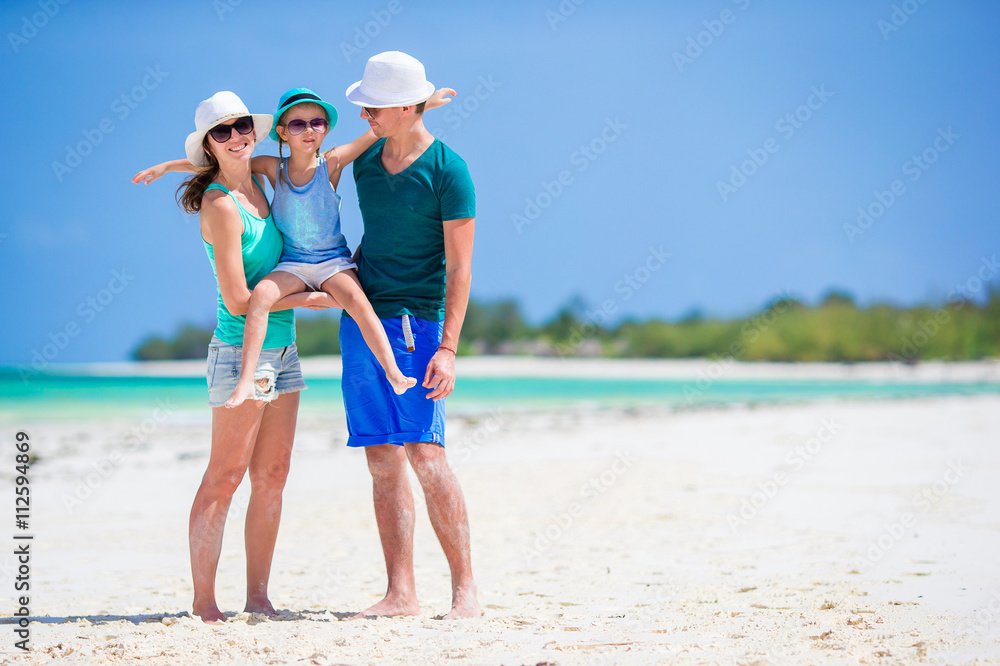 Happy family at tropical beach having fun together Happy family at tropical beach having fun together