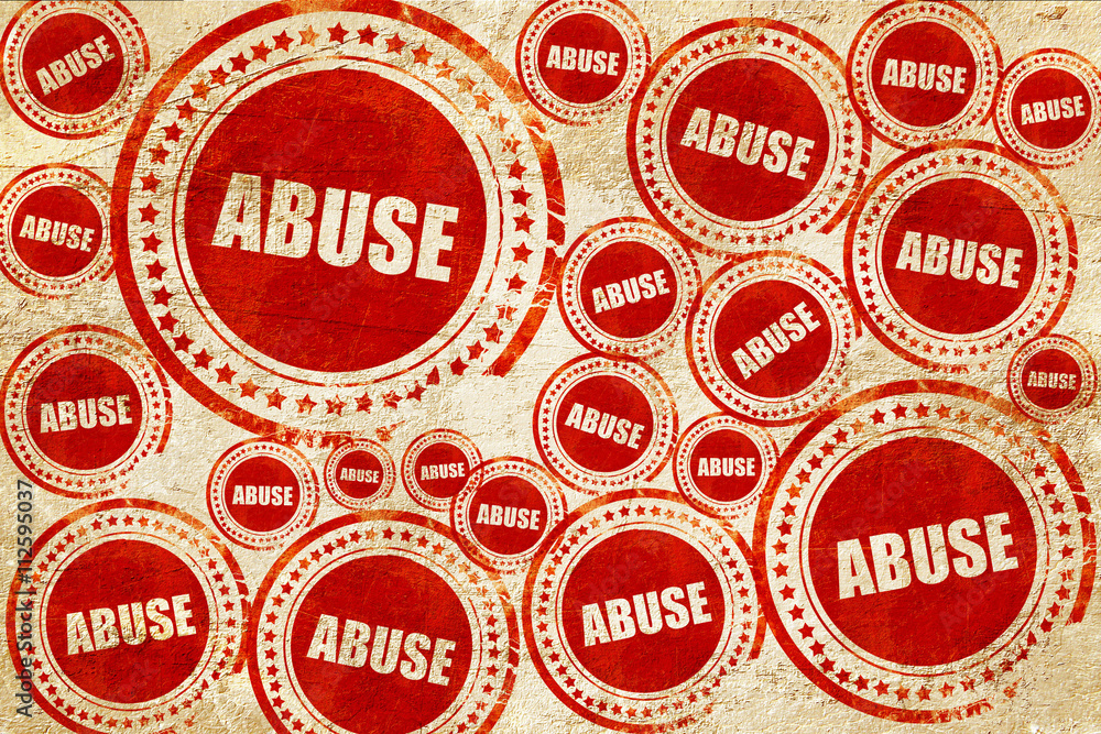 abuse, red stamp on a grunge paper texture