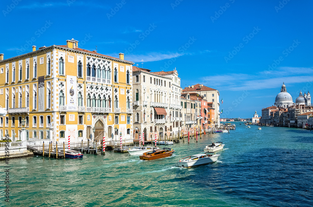 Grand channel surrounded by houses and Basilica, Venice