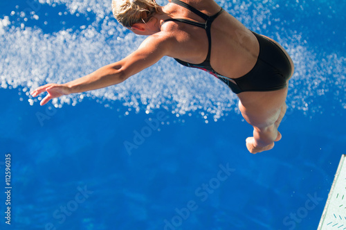 Spring board diver takes a leap