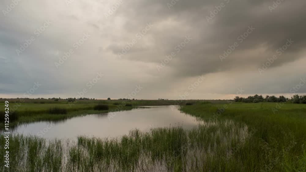 Russia, timelapse. The formation and movement of clouds over summer endless green fields of grass in the steppes of the Don. Russia, timelapse. The formation and movement of clouds over summer endless green fields of grass in the steppes of the Don.