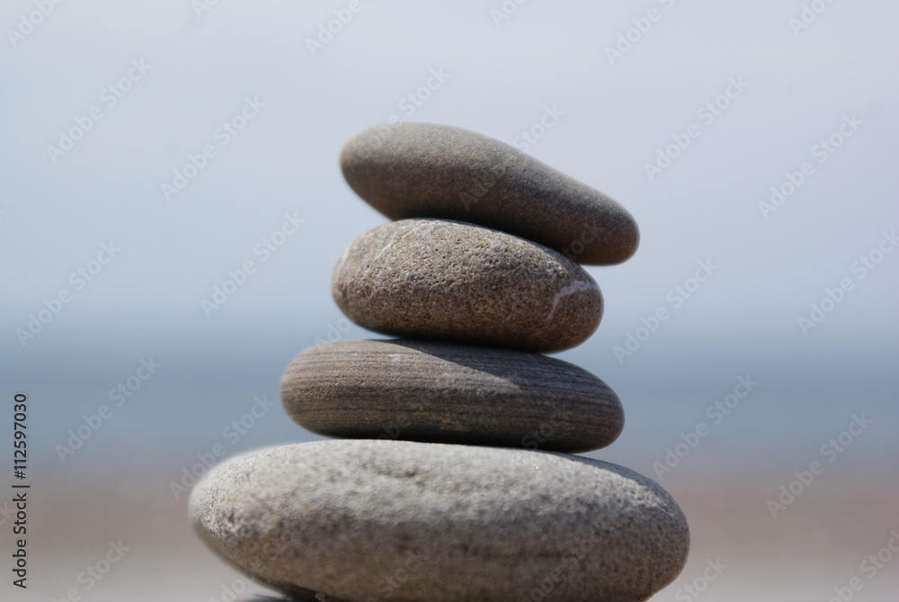 Balanced stones with sea and sky landscape background. Balanced stones with sea and sky landscape background.