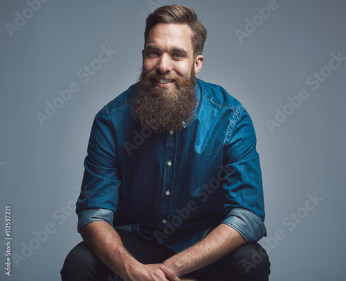 Принти на полотні Handsome smiling man in blue shirt and beard