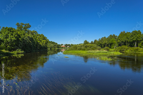 Fototapeta Naklejka Na Ścianę i Meble -  Summer solar landscape;,  river and blue sky