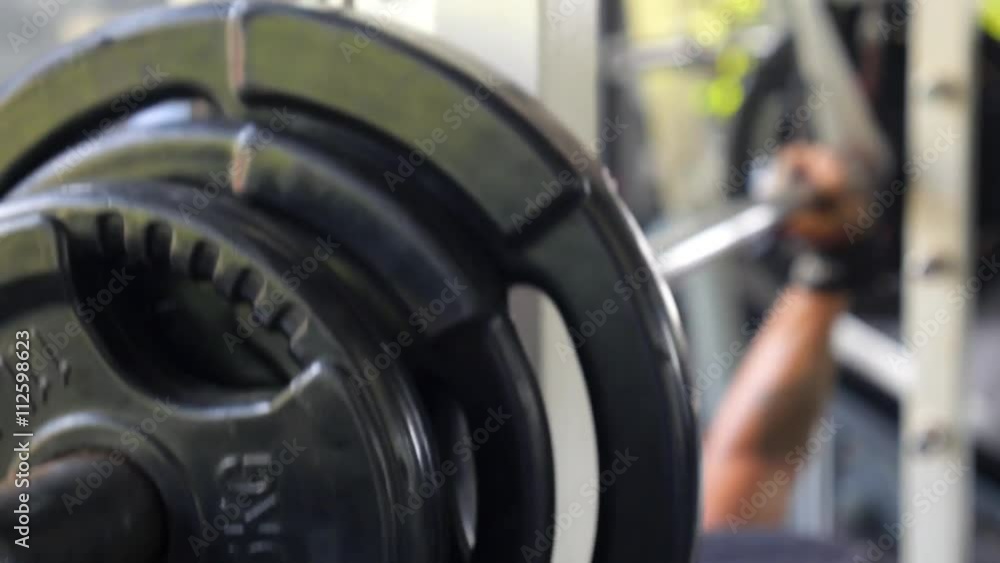 Man with Dumbbell Weight Training Muscles in Sport Gym Man with Dumbbell Weight Training Muscles in Sport Gym