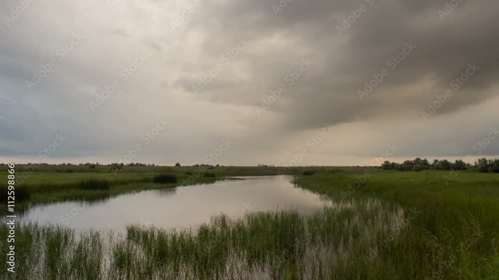 Russia, timelapse. The formation and movement of clouds over summer endless green fields of grass in the steppes of the Don. Russia, timelapse. The formation and movement of clouds over summer endless green fields of grass in the steppes of the Don.