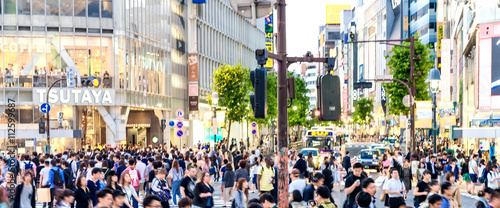 TOKYO - JUNE 1, 2016: Shibuya Crossing at dusk with tourists. Sh