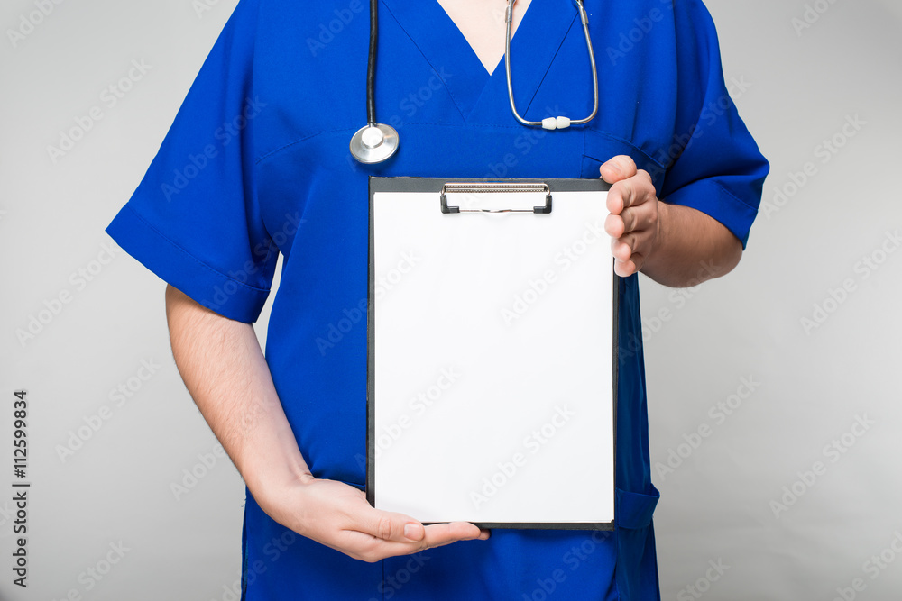 Doctor holding a blank form Doctor holding a blank form
