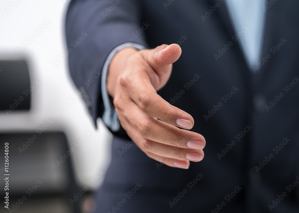 Business man offering handshake

