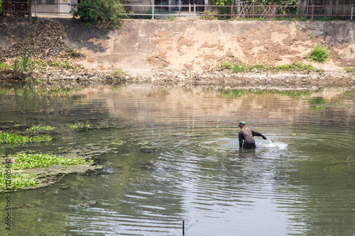 Fisherman in Ping River in Lampang City Thailand 