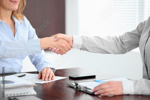 Business people shaking hands, finishing up a meeting